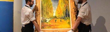 Getty Images
Gallery technicians carry Vincent Van Gogh's 'L'Allee des Alyscamps', at Sotheby's in London